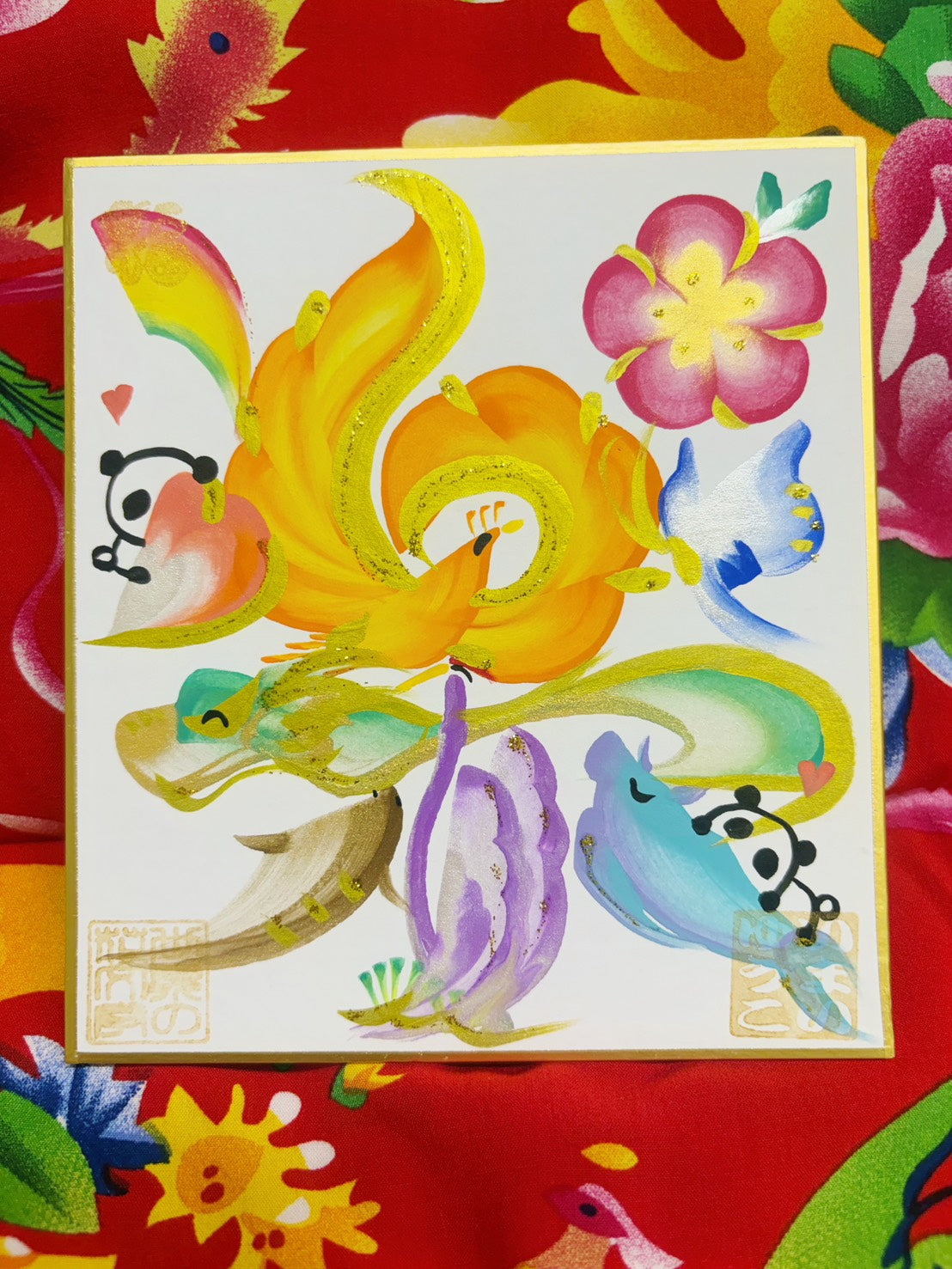 The character for "raku" (enjoyment) in a floral design.