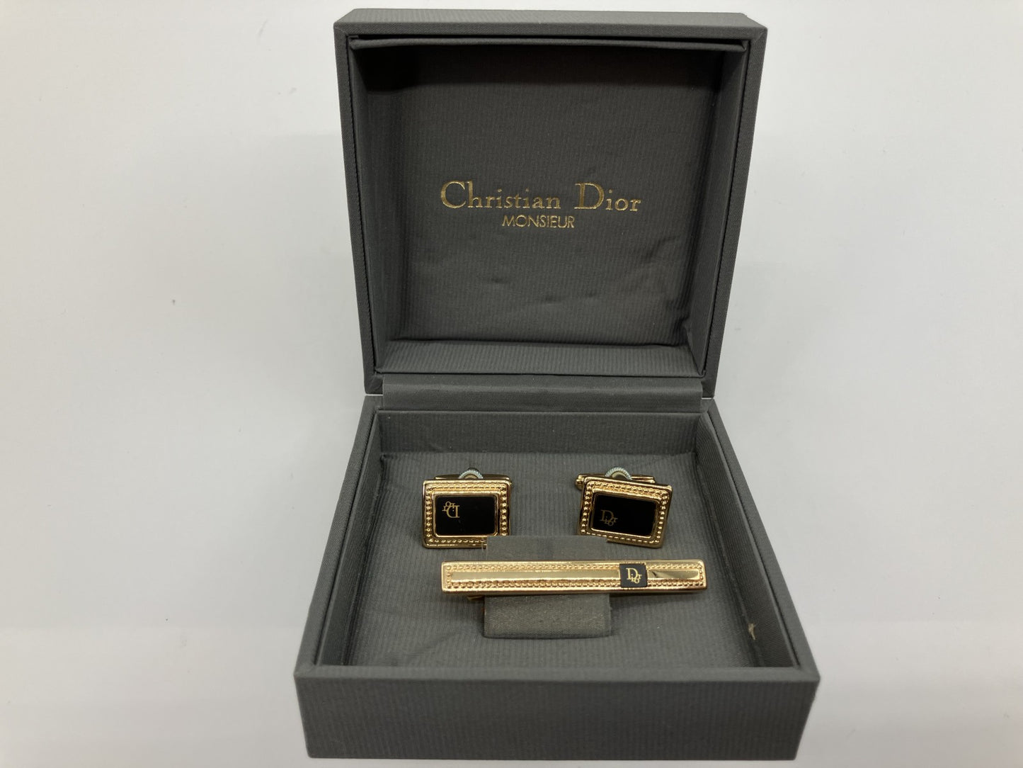 Christian Dior cuff and tie pin set, gold and black, with box,