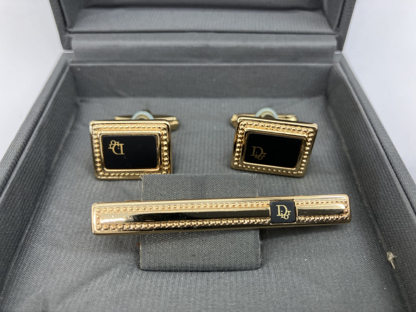 Christian Dior cuff and tie pin set, gold and black, with box,
