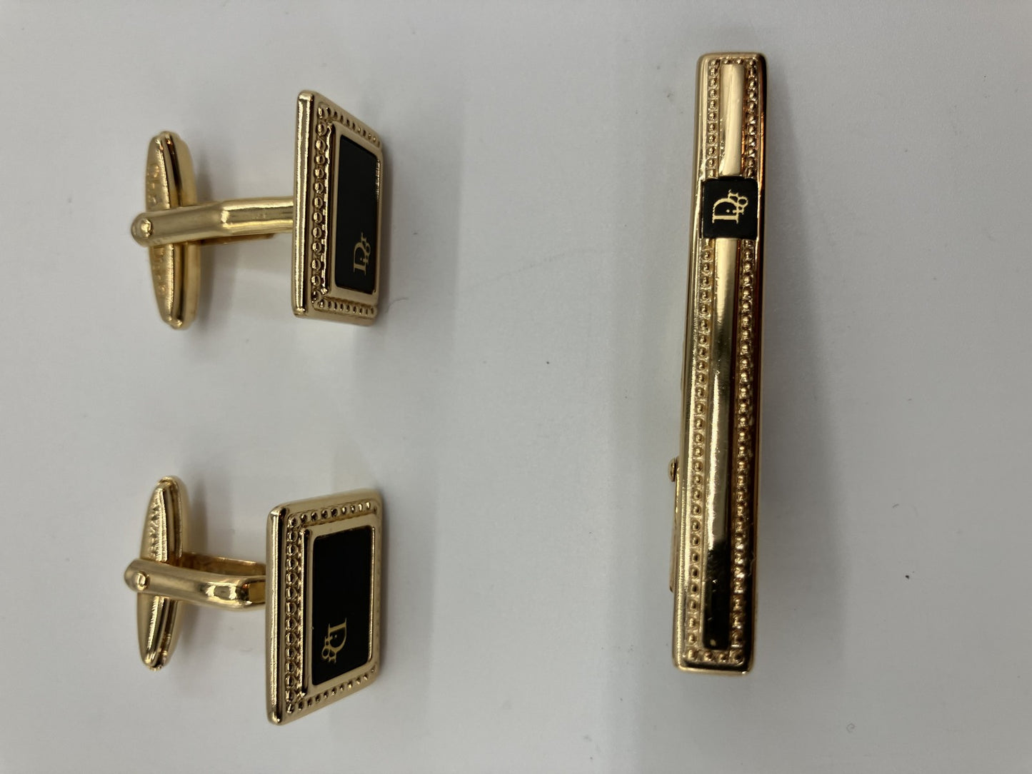 Christian Dior cuff and tie pin set, gold and black, with box,