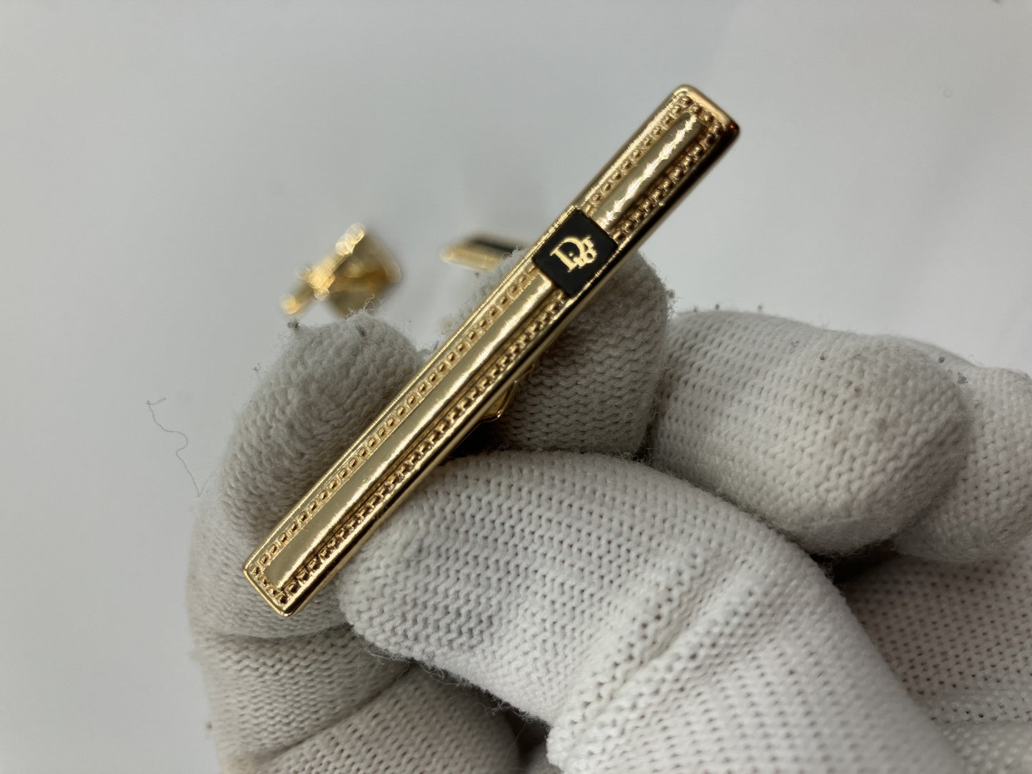 Christian Dior cuff and tie pin set, gold and black, with box,