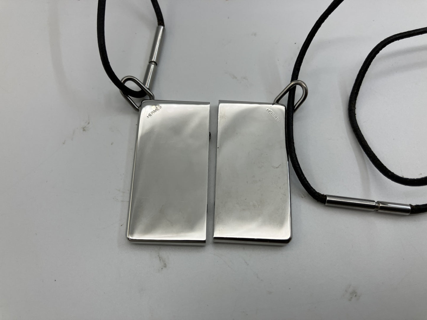 HERMES Symbol Pair Necklace 2000 Silver-Tone Metal Top 4×2cm Black Leather Cord with Box