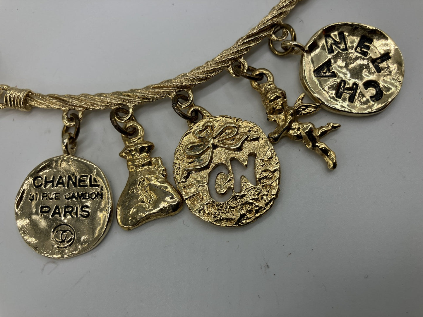 CHANEL Vintage Charm Necklace Gold Tone Coin Angel Perfume Pendant
